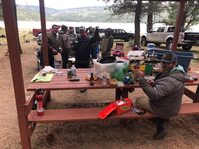 A group of anglers gathered at a picnic pavilion near Round Valley Reservoir